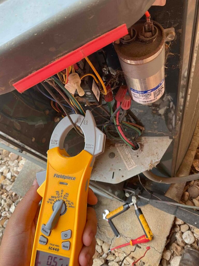 Heating repair service checking electrical connections and system performance in Arlington, TX